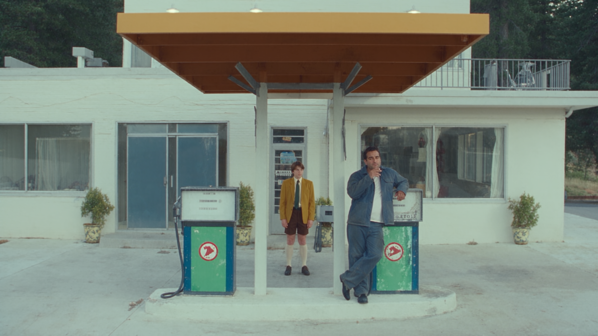 Still from Introducing Rocco Studio: two figures at a mid-century petrol station